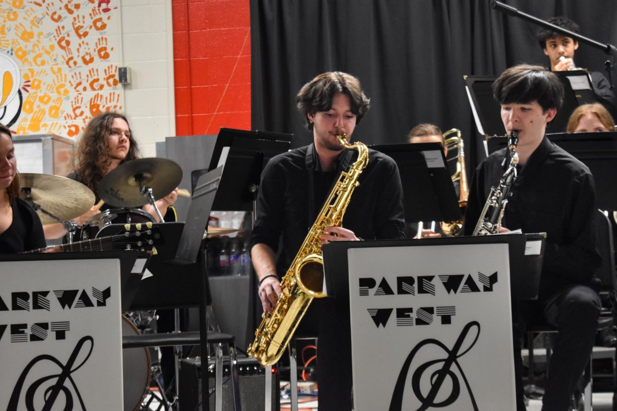 Senior Devin Melter performs in front of a crowd in his last performance. The Jazz Coffee House is an annual jazz event that takes place at West High’s cafeteria. “To me, band is an expression of art in a way. Music has been a big part of my life for at least seven years now. [I] started in middle school, and now I'm four years in [and] going to do it in college,” Melter said. “Jazz Coffee House is a really fun event that our jazz band does at the end of our year. It expresses how good our jazz band is.”