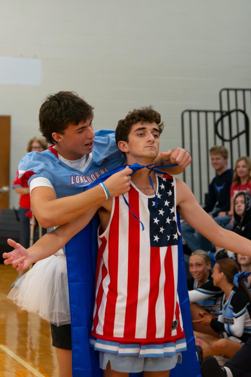 Arms wide, senior Matt Lancia receives the blue Spirit Court King cape from senior Leyton Usry.With this being Lancia’s last year, it was important to him to leave a positive legacy. “I was definitely loud. I made a lot of friends. Hopefully, people think I was nice and that I brought joy to people,” Lancia said.