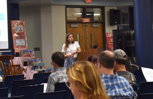West High seniors and families listen as a representative of The Scholarship Foundation of St. Louis, Teresa Steinkamp, leads a Free Application for Federal Student Aid (FAFSA) workshop. This session, held in the library, provided guidance on financial aid, scholarships and student loan options. “This event is very beneficial for any seniors who are applying to or considering applying to colleges after high school [because] the cost of college is on the rise for seniors and parents,” college and career counselor Chris Lorenz said.