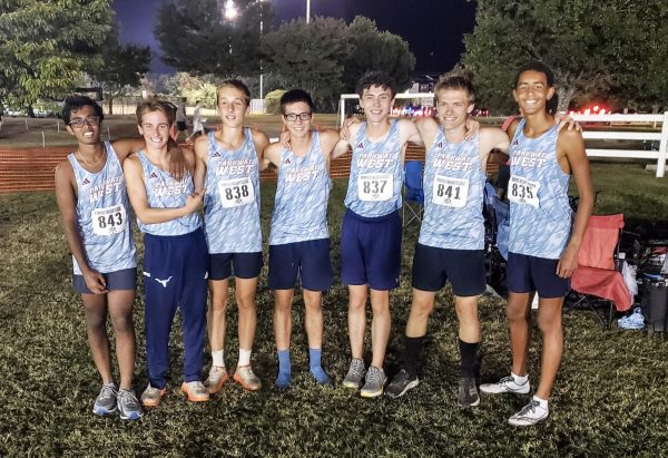 The varsity boys cross country team poses for a photo at the Mike Rose Soccer Complex in Memphis, Tenn. The Memphis Twilight Classic is the largest event the team attends. “[I enjoyed] hanging out with the team every day at practice,” Patten said. “I wanted to be the best I could for my team; I really wanted to help out.”