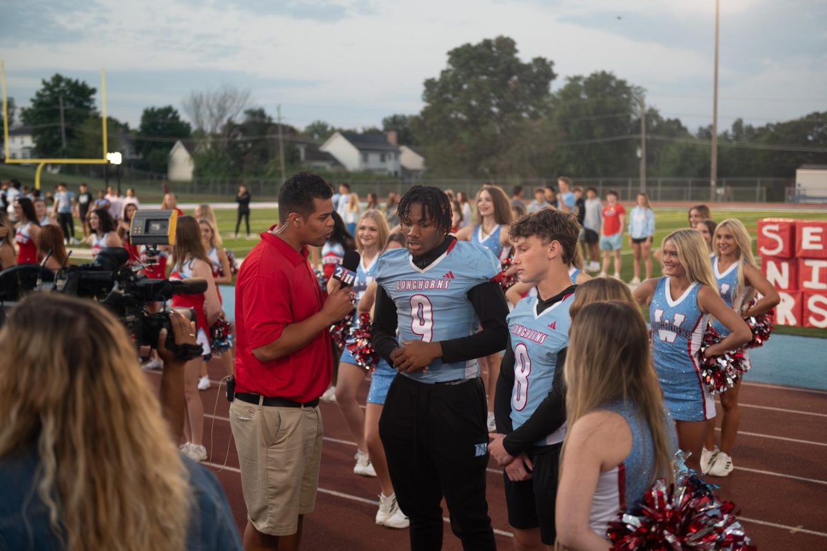 Standing in front of the camera and next to Fox 2 News' Ty Hawkins, senior and varsity football player JaMont Brooks represents the varsity football team. As captain and outside linebacker, Brooks was one of four students selected to be interviewed live for the broadcast. “Overall, it was just a crazy experience being on the news. Even when I get older, I’ll tell my kids or grandkids I was on the news. My mom sent me a picture of me on the news [saying] ‘Oh my gosh, that’s my son.’ The Parkway West community felt amazing this morning. Everybody showed up at 6 [a.m.] and [will] show up 6 [p.m.] tonight too. Any time I go into a game, I go up there with the mentality that we’re going to try our best, and even the times we struggle, [I’ll] keep my head up,” Brooks said.