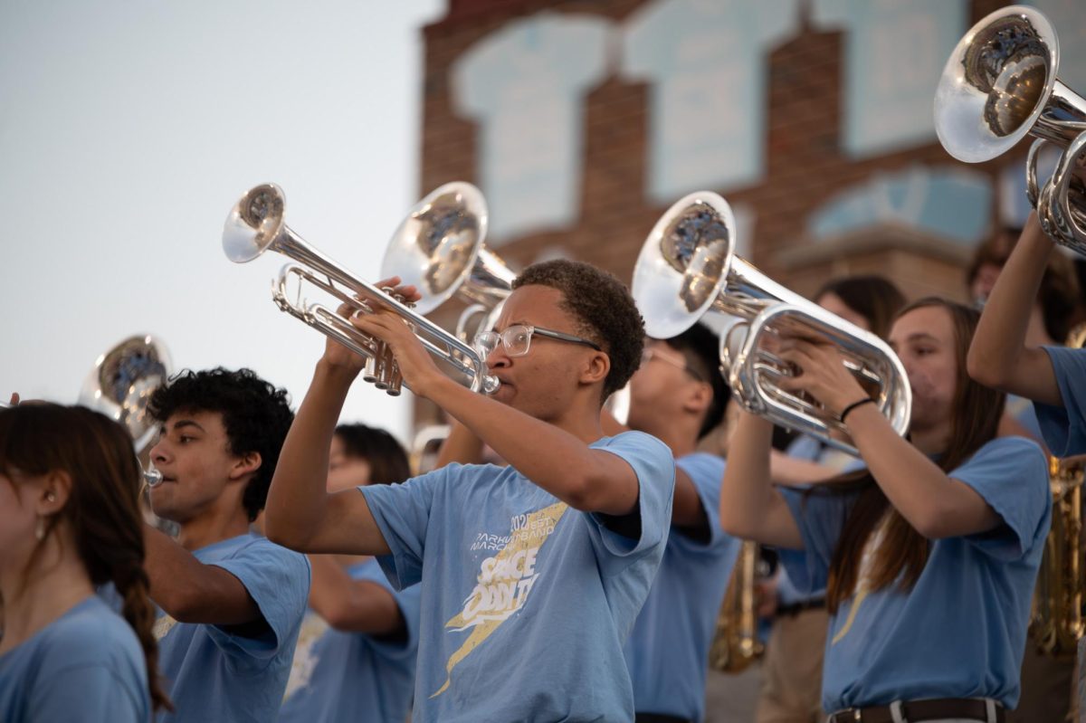 Blowing his trumpet and filling the stands with energizing notes, senior Cole Kayira performs with the marching band at the pep rally. For Kayira, the performance was a memorable milestone for his senior year. “I felt really excited, and I did wake up really early to prepare. But it felt nice playing for all the people in the crowd and in the field, because this will be the last time, and first time I'm ever having this happen. I tried making sure I had a positive attitude, because my attitude does affect how I play. I tried making sure I had the best mindset going on to the stands,” Kayira said.