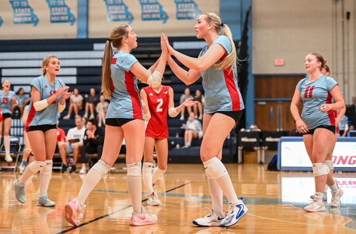 After a thrilling point, senior Katie Byergo and junior Elle Lanferseick high-five each other on Oct. 8. With teamwork and camaraderie, Byergo worked together in the game against Lafayette High School. “[Byergo’s] is really positive with a good spirit,” Lanferseick said. “I set her [the ball] and she hits it [or] gets the kill.”