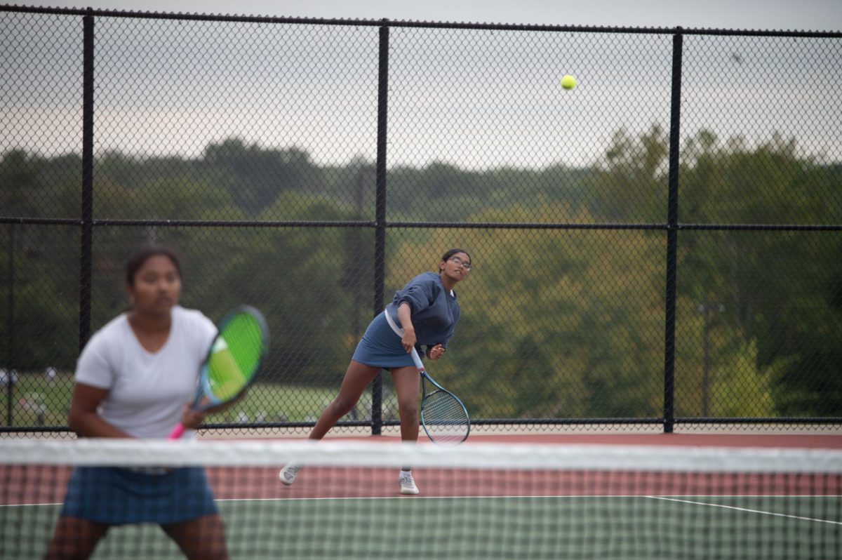 Sophomore Shree Sikkal Kumar serves the ball across the court in a match against Lindbergh. Sikkal Kumar has been a varsity member of the varsity girls’ tennis team for two years, helping her earn the number two rank in Class 2 District 2.“When matches are close, it’s easy to get nervous, but I [ground] myself by[staying] confident and ready to play,” Sikkal Kumar said.
