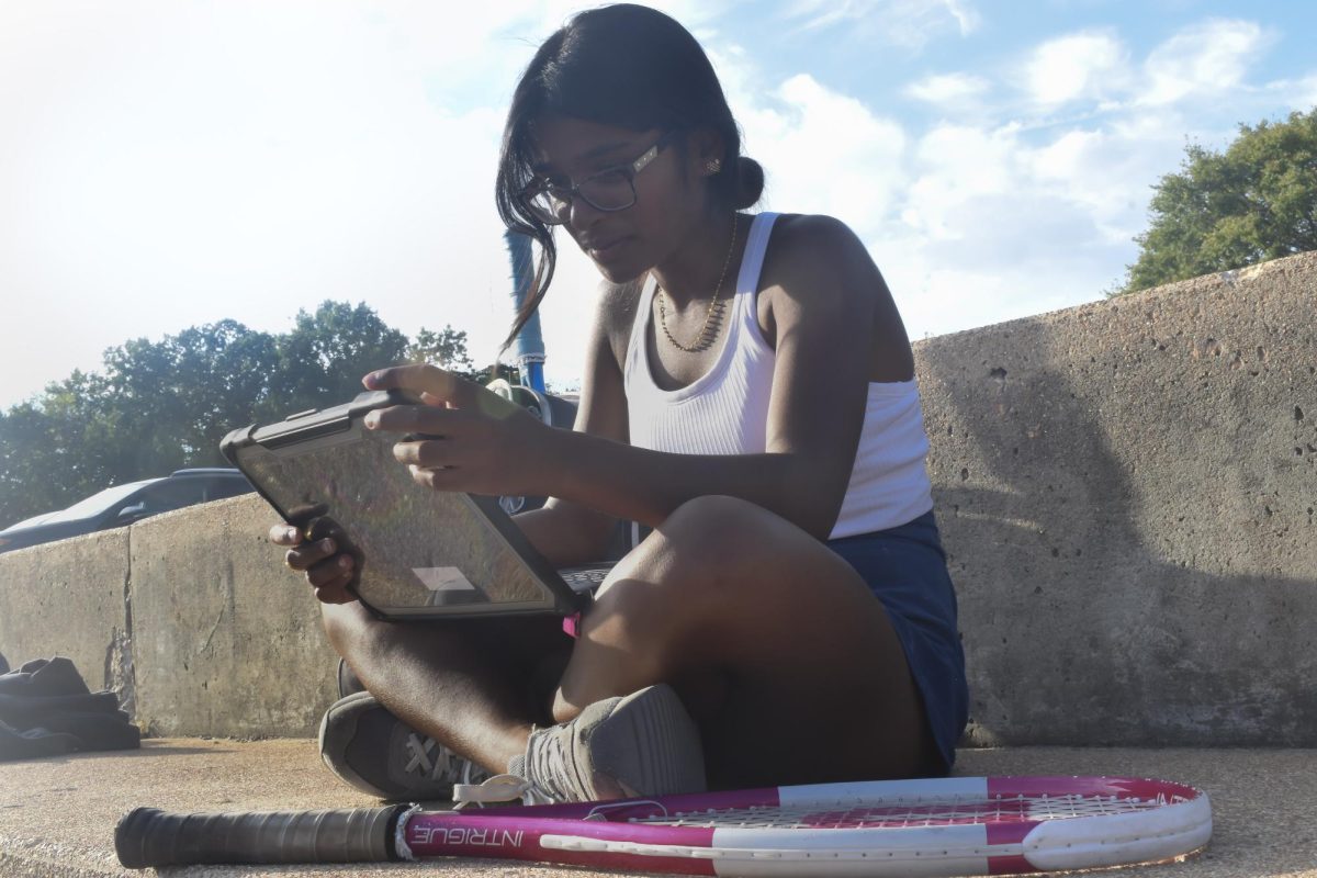 Sitting courtside before a junior varsity girls’ tennis match, senior Tanisi Saha rushes to finish her homework. Saha has found herself doing academic work during her athletic activities since her freshman year. “Being in sports has taught me how to stay organized and on top of my schoolwork. [With] a busy practice and game schedule, I’ve learned to manage my homework and study time better,” Saha said.