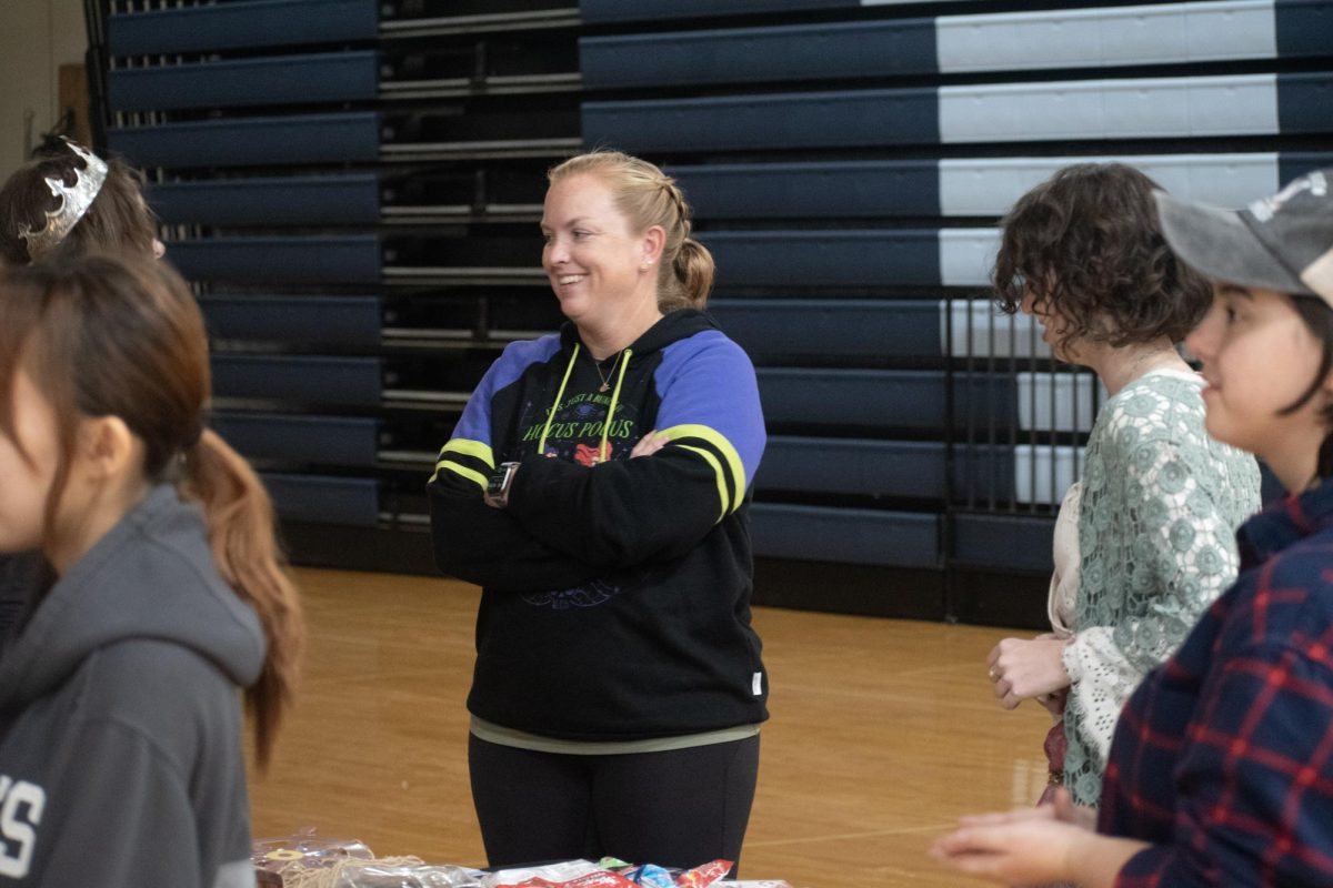 Laughing about a joke made by a trick-or-treater, Longhorn Council Director Katelyn Arenos helps manage the event. Arenos believed in events like these strengthening the community and bringing everyone together. “It’s just fun to see the community come together for a cool event like this. Everyone is happy and having a great time with each other,” Arenos said.