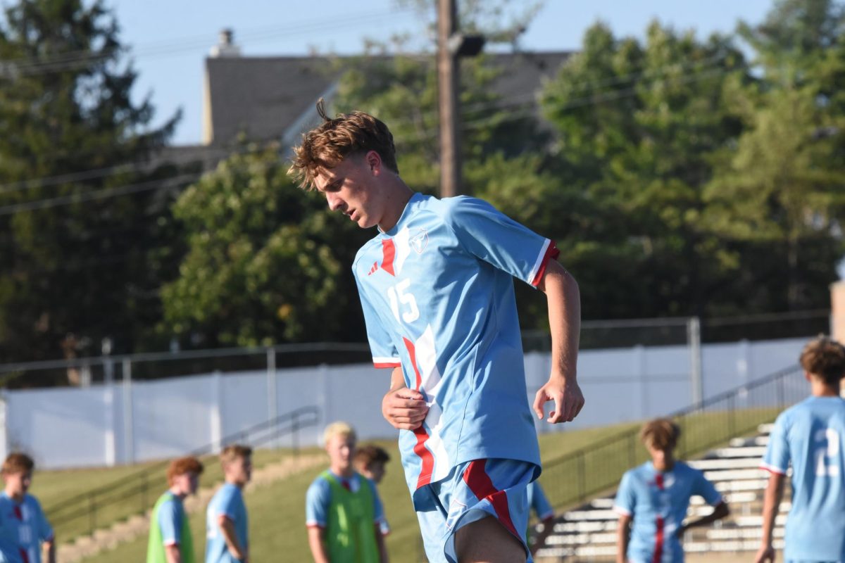 Getting warmed up to play, senior Cameron Spangler focuses on preparing his mind and body for his upcoming soccer game. As a forward, Spangler has been a varsity starter for four years. “We have had a really good season so far, but we have to keep building on the momentum we have so we can have a strong end to the season,” Spangler said.