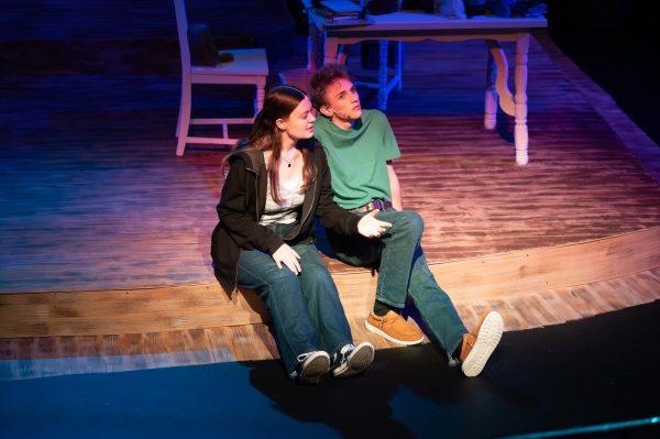 Gazing up from the stage, junior Joseph McCurdy who played Peter Pan in the school play, Lost Girl, sits next to senior Juliana Rogers, who plays Wendy Darling, during a theater rehearsal. McCurdy’s passion for theater began when he observed a West High production in middle school. “I've been in the high school theater program since I was a freshman. I've always loved theater, but [what prompted me to join] was [when] I went to see [a performance here] when I was in middle school, and it was super cool,” McCurdy said.