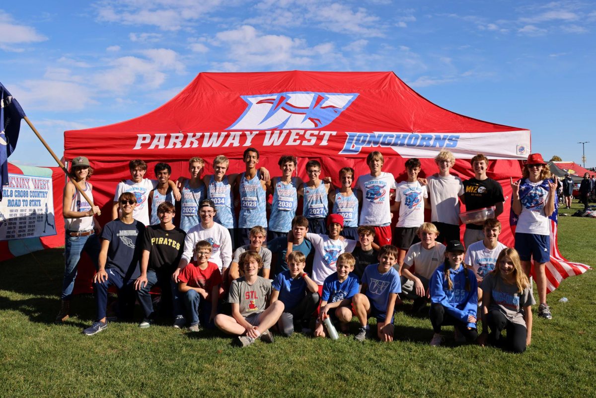 The boys cross country team poses for a photo after racing in the state meet. Every early morning and afternoon practice led to the team’s final race of the season. “We run as a team, and we finish as a team,” junior Xavier Merriman said.