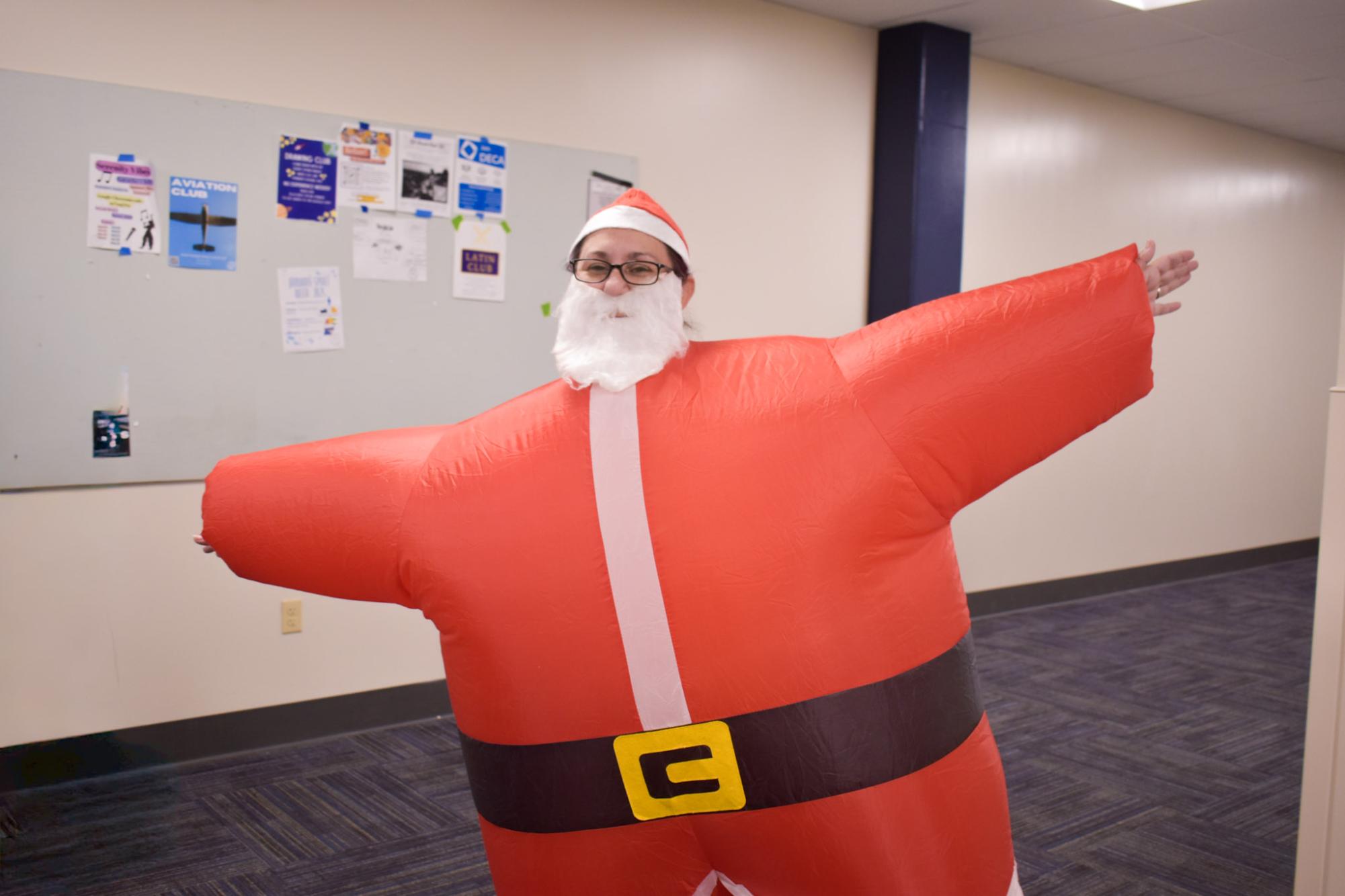 Waddling through the halls, proudly displaying her inflatable Santa costume, English teacher Michelle Kerpash is determined to win the Parkway Holiday Cup. "It's Winter Character day, and we are clearly going to win the holiday cup," Kerpash said.