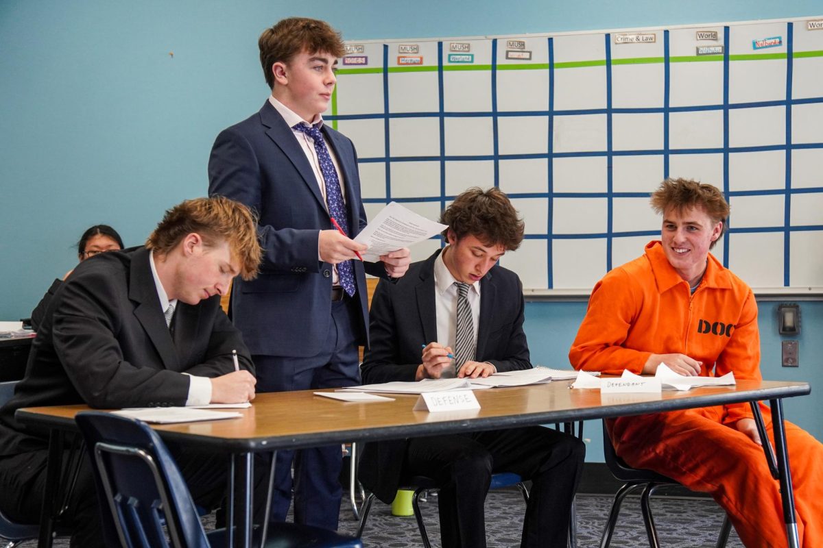 Getting him out of a murder conviction, junior Joe Wild’s lawyers in Crime and Law class defend him. On Dec. 15, Wild participated in a mock trial where his defense team built a case to prove his innocence. “My [defense] team prepared really well for my case and managed to get me off the hook. It was cool to see how a court operates and what happens inside of it, especially since we ended up winning the case,” Wild said. 