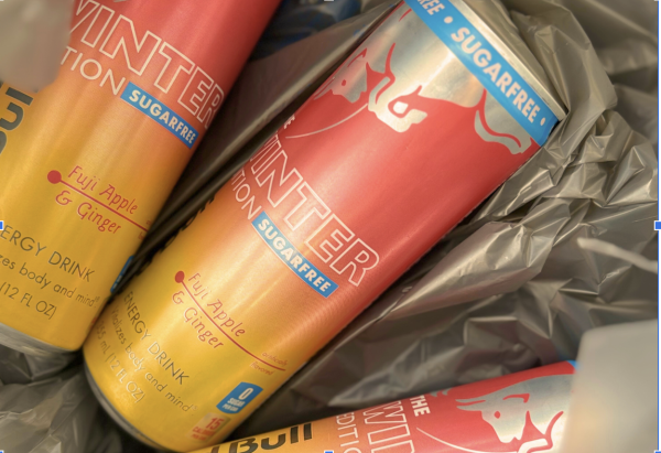 Newly released Fuji Apple & Ginger Red Bull cans rest inside a Walmart bag, ready for their first taste test. They were picked up after a search through the energy drink aisle, sparked by the hype surrounding Red Bull’s 2025 Winter Edition. They captured the excitement of students eager to try the season’s latest flavor.