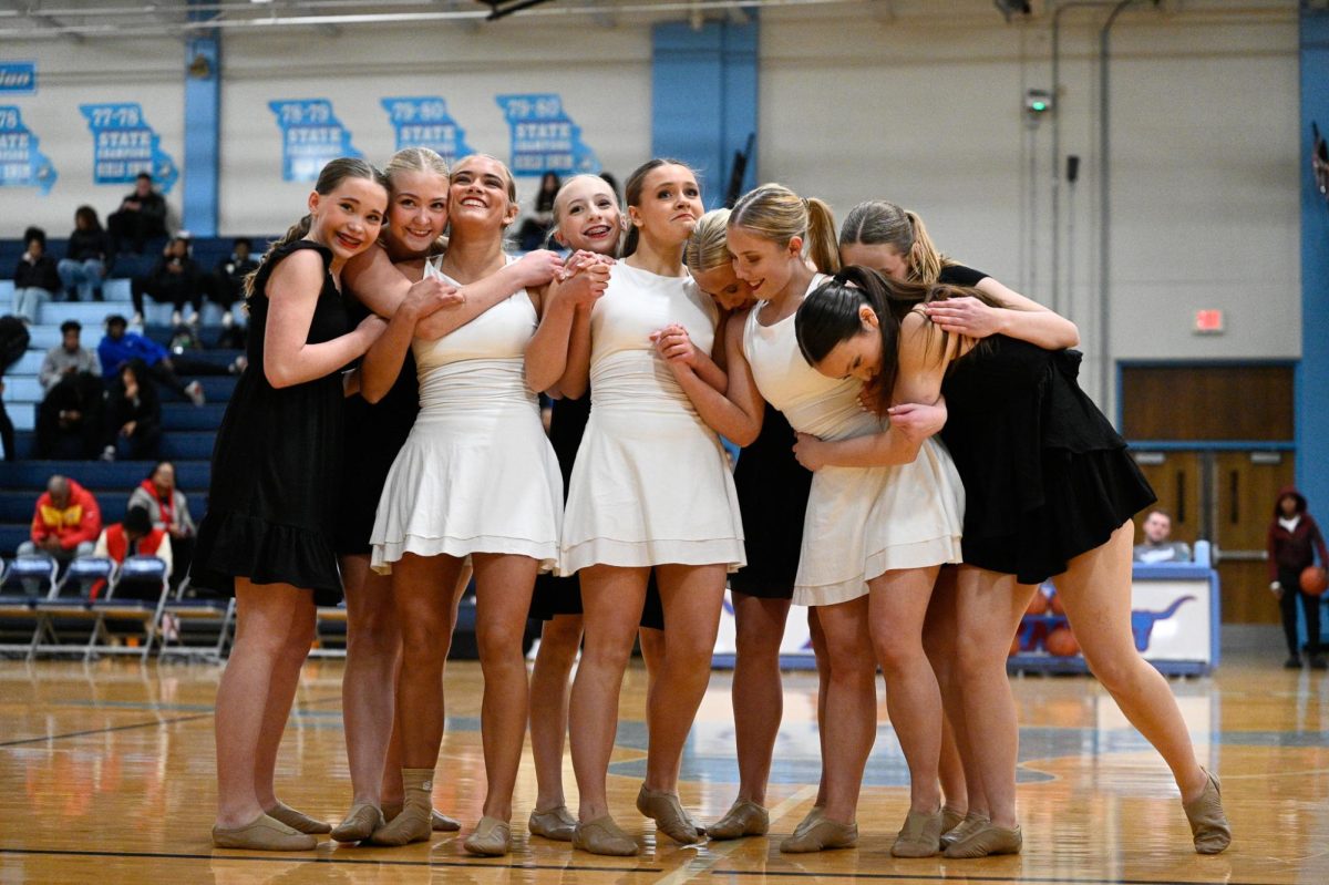 Coming together in a hug at the end of their performance, seniors Emma Callahan, Lila Kayser, and Lily Overmann are honored at the end of their senior night on Jan. 23. For Longhorn Line, a special part of senior night is performing a dance choreographed by the team's seniors, who have had a particularly successful 4 years of dance. “We won state for both of our dances last year, which was a huge accomplishment for us [as dancers], and the program. Longhorn Line has been such a big part of my life, giving me memories and friendships I’ll never forget,” Callahan said.