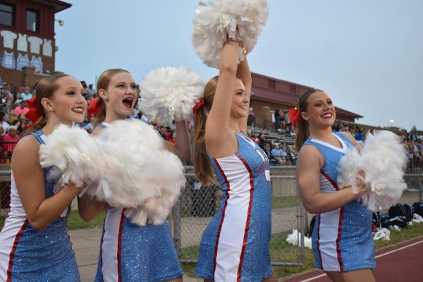 Smiles high and pom-poms higher, Junior Sophia Allen jumps with excitement for her dance team. Their performance lit up the sidelines and kept the crowd energized all night long. “No matter the stress or pressure I feel in life, dance is [always] my escape and priority,” Allen said.