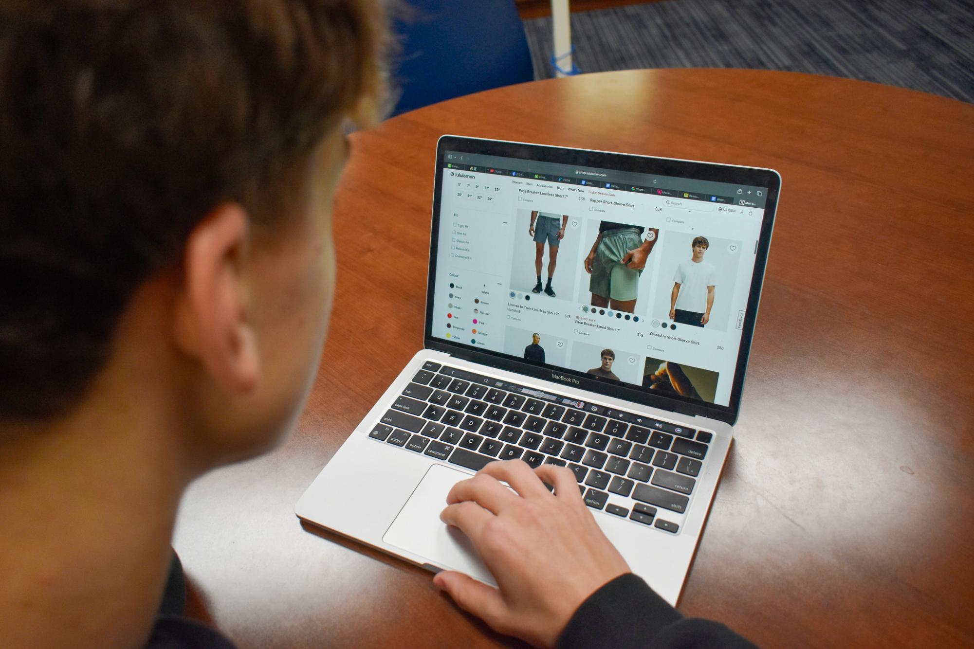 While scrolling on an online website, junior Patrick May looks to add more clothes to his wardrobe without leaving his home. May plays baseball and often needs new clothes to keep up with the demands of his athletic lifestyle.  “I enjoy the ability to see and touch products at a brick-and-mortar store, but I also enjoy the ease of clicking 'Buy Now' on Amazon,” business and marketing teacher Andy Croley said.