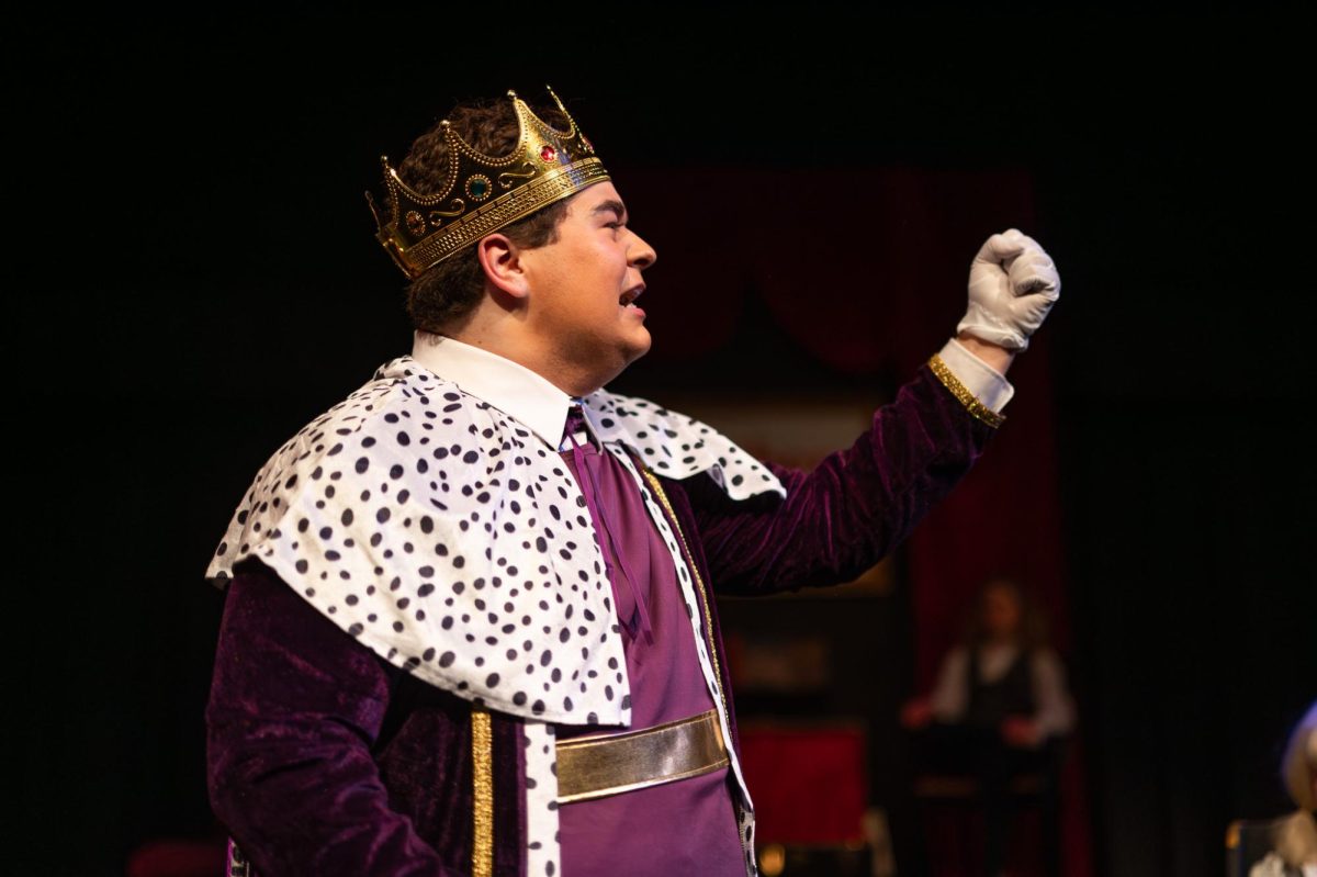 Fist in the air, sophomore Noah Mueller plays the king in the “Brothers Grim Spectaculathon.” On Mar. 4, the Parkway West theater department worked through a dress rehearsal in preparation for the performances scheduled on Mar. 6 and 7. “[The theater department] is a home, really. It’s so much fun, and especially this [play] is so fast-paced and funny compared to the others. The script is hilarious, and I can’t wait for people to see it,” Mueller said. 