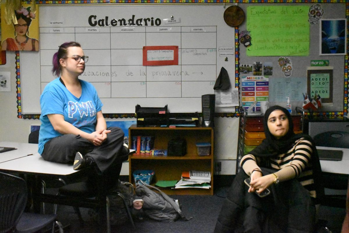 Spanish teacher Jessica Verywest and senior Zoya Hasan listen in on a conversation related to Dance Marathon funds. Dance Marathon is making the final preparations for its event on April 22, 2026. Senior Zoya Hasan talks about how she has enjoyed the process of preparing for Dance Marathon so far this year. “My favorite part of going there [Dance Marathon] with my friends Friday mornings, its been a nice routine that we get to promote Dance Marathon with,” said Hasan.