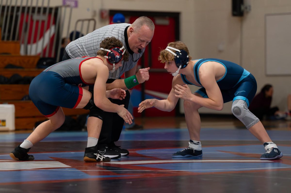 On Jan. 29, sophomore Braiden McGrath stands ready and in position to attack his opponent. Parkway West Varsity took a 49–21 victory over Parkway South. “My coach once told me that pressure makes diamonds, and I took that to heart,” McGrath said.