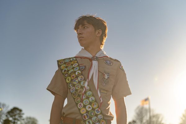 Senior Michael Collop stands in the sun at Vlasis Park in Ballwin, Mo. Collop has earned each of the 142 merit badges currently offered by Scouting America, joining the estimated 650 other Scouts who have done the same. Out of roughly 130 million youth who have participated in Scouting, only 0.00077% have achieved this distinction. “The whole point of merit badges is to learn something from them and get a glimpse into every single career or every aspect of [Scouting]. I think I took something from each one of those merit badges that's [going to] be with me for the rest of my life,” Collop said.