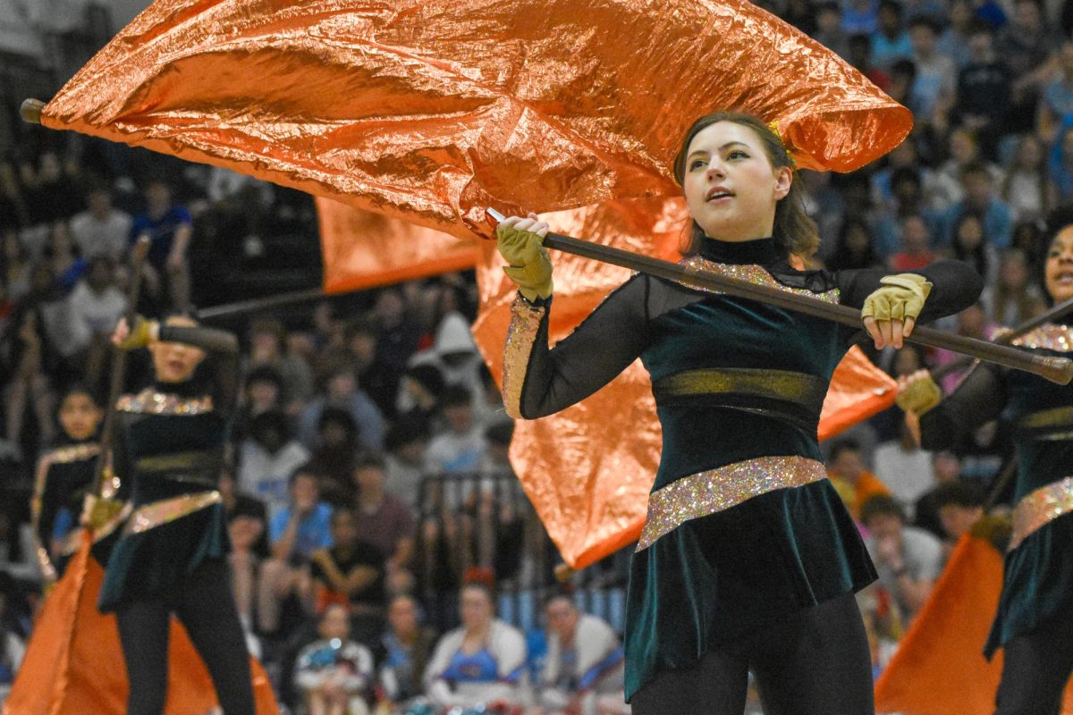 Senior Ella Early performs with the Parkway West Winter Guard in their last show of the season. The performance’s goal was to push the audience to engage more with one another and with society as a whole. This year, the winter guard earned their highest score in the past four years at the Mid-Continent Color Guard Association Competition. “When I was starting the show, my friend was sitting right in front of me, [but] she got a concussion [and] wasn’t able to perform with us, so she was making faces while I was performing. I was trying so hard [to keep a straight face]. It was one of our best performances. This was my last one forever with our school, so it’s very special, [and] I’m really glad that the school got to see it,” Early said.
