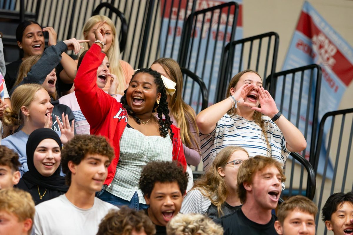 Senior Kamori Berry smiles and pumps her fist in the air during the first school pep rally.  Berry is in charge of LOCO, meaning she makes plans for events like pep rallies and has been on the committee all four years. “I love being the president because you really get to know all the kids in your class, and it’s cool knowing you make big decisions based on them,” Berry said.