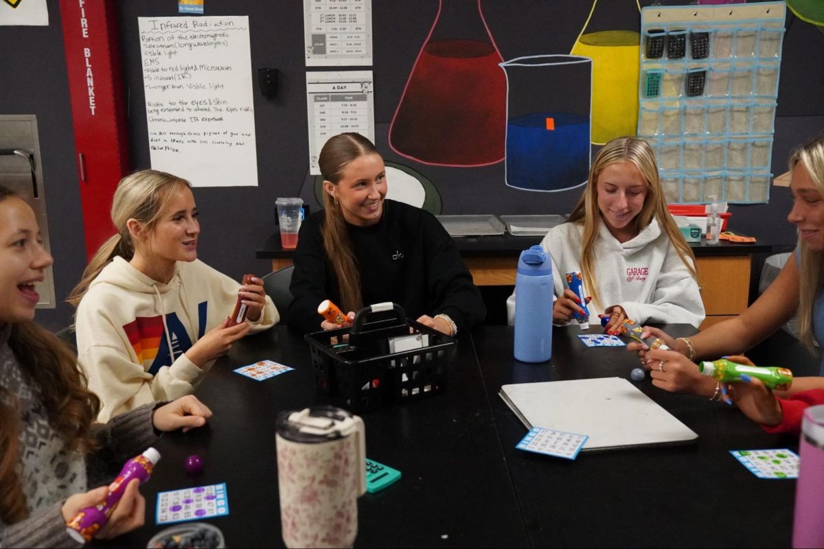 Junior Ava D’Alessandro laughs with friends as she waits for the next number to be called during a Bingo Club meeting. The meeting took place on Feb. 6. “It’s a really relaxed atmosphere. Everyone is nice, and it’s just fun to hang out with friends during the day,” D’Alessaandro said.
