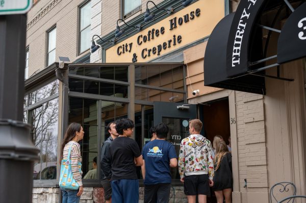 French teacher Blair Hopkins enters City Coffee & Creperie in Clayton, Mo. for breakfast with her Honors French 4 students and AP French 5 students. Both classes went on a field trip to a fair trade chocolate factory in St. Louis to begin their unit on Côte D’Ivoire, a major producer of cocoa beans. “My ideal school would just be the Magic School Bus — you would always learn about things by going someplace and learning hands-on, being able to see it yourself and asking people questions. I think [learning is] always so much more memorable if you can experience it firsthand,” Hopkins said.