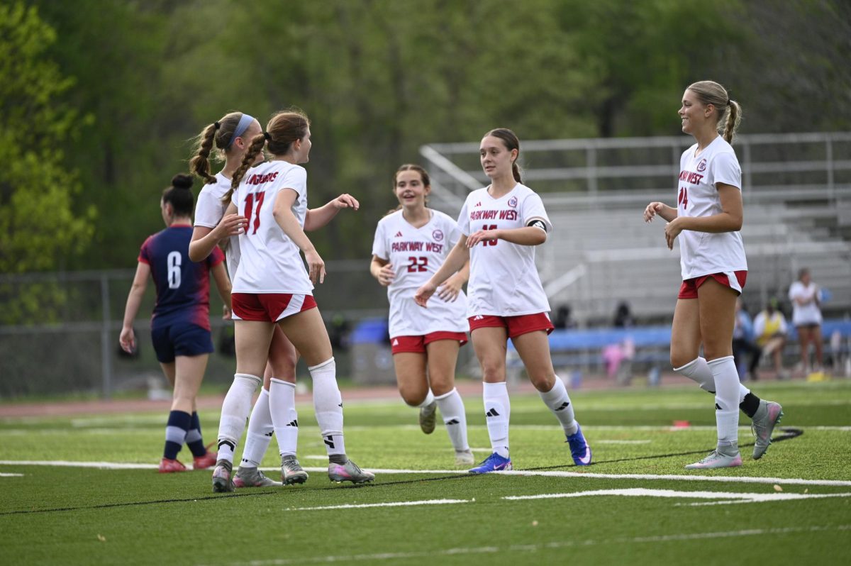Running across the field, senior Maggie Leahy rushes up to her teammate with her arms wide open to celebrate a goal against the Parkway South Patriots. West beat the Patriots 3-0 in their April 15 matchup. “It’s a strange feeling knowing this is my last season of high school soccer. Every year, I look forward to spring when I get to play my favorite sport with my best friends. Since this is my final year, I am focused on having a successful season filled with memories I can look back on and smile about,” Leahy said. 
