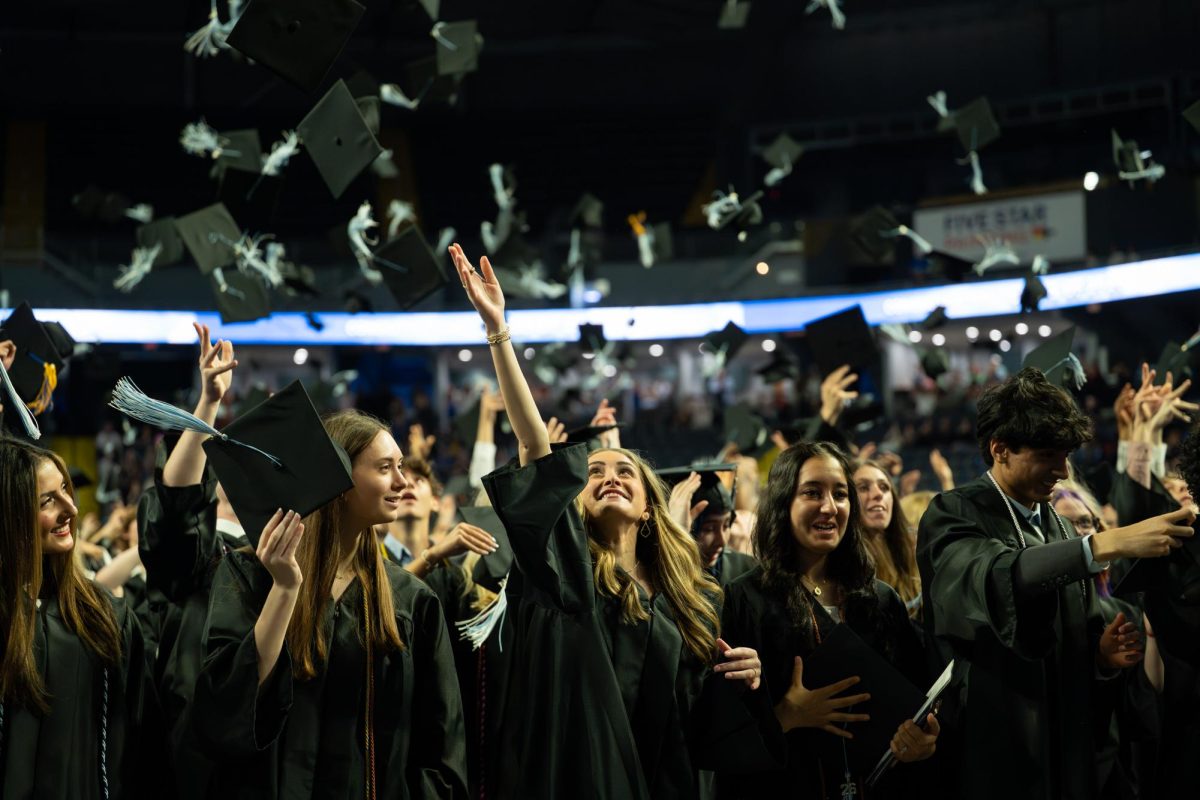 Hand raised into the air, senior Lauren Anstrom watches as her graduation cap flies along with the caps of all her peers. Anstrom hopes to leave behind the legacy as someone who was kind, hardworking, and always supportive of others. “Tossing my graduation cap honestly felt surreal. In that moment, everything hit me at once with all the excitement, relief and a little sadness too. It felt really emotional [because] this was the end of such a big chapter of my life, but also exciting knowing that everyone was about to start a completely new journey,” Anstrom said.
