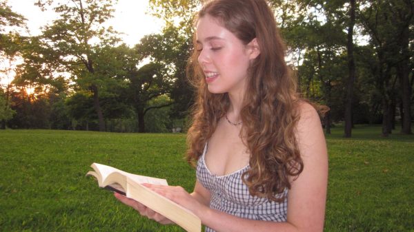 Sitting in the grass, juniors Malia McLellan flips through a book, blissfully ignoring her phone. Like McLellan, junior Danny Casserly often finds himself stuck on social media, rarely engaging with non-digital media in his free time. "When I go on TikTok, I try to watch videos that are educational, but I usually end up going down rabbit holes," Casserly said.