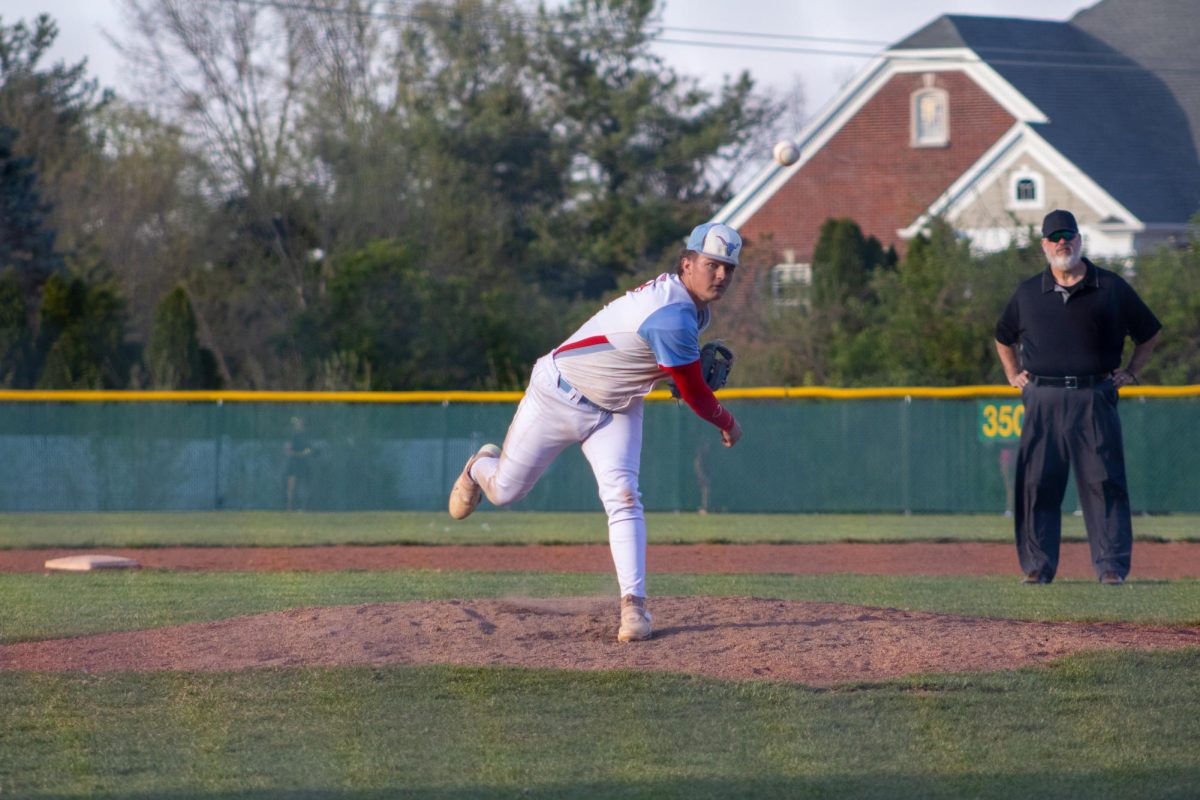 Senior Carson House throws the baseball across the field with his arm extended as the ball leaves his hand with force. House first started his baseball career at the age of five. “I chose baseball because I love being outside and playing sports, and [baseball] continues to challenge me [both] mentally and physically, which is something I enjoy. I will miss being able to play with my teammates [and] playing against a good local competition,” House said. 
