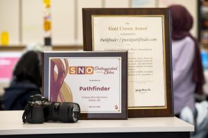 Two of Pathfinder’s most recent editorial accolades shine on display in journalism teacher Lindsey Katz’s room. Pathfinder was recognized as a SNO Distinguished Site on April 24. “Praise isn’t everything, but it feels so nice to see the hard work of our staff recognized. So much more than just writing words on a page occurs [in journalism], and I am so glad people see that. I love being surrounded by such talented writers, but also such great people,” editor-in-chief and junior Payton Dean said.